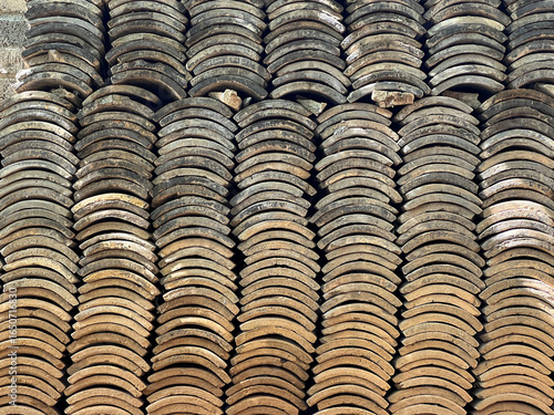 Stacked Curved Tiles Forming a Textured Pattern