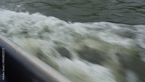 Boat Wake Moving Forward Through Water, View from Deck Looking Down