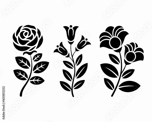 Three stylized floral silhouettes including a rose and bell flowers isolated on white background