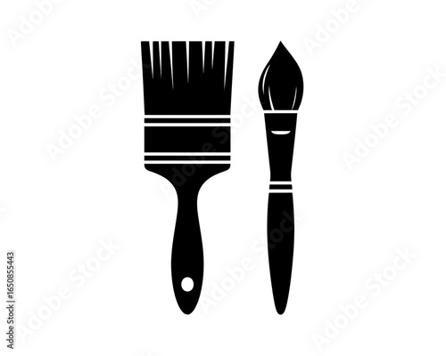 Two black paint brushes silhouette isolated on white background