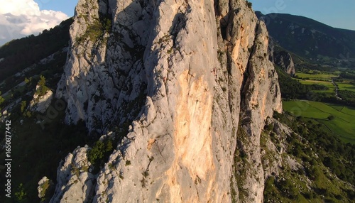 Climbers on a steep rock face