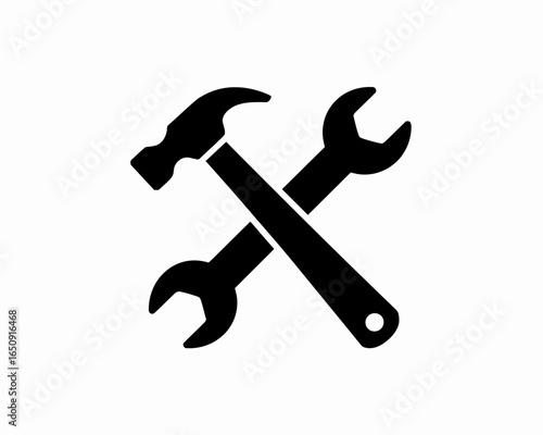 Black silhouette of a hammer and wrench crossed together isolated on white background