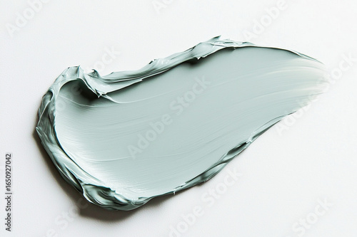 Skincare cosmetic cream texture with smooth swipe on clean white background. Beauty moisturizer product suitable for face and body wellness care.