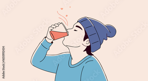 Person enjoying a hot beverage in a cozy winter hat and blue sweater