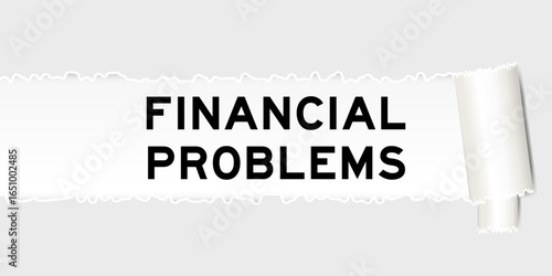 Ripped gray paper background that have word financial problems under torn part