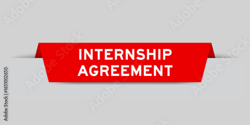 Red color inserted label with word internship agreement on gray background