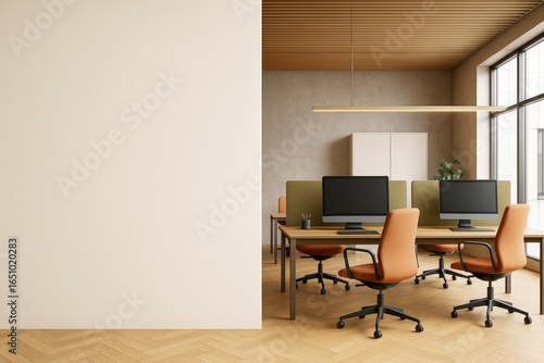 Modern office interior with computers and blank wall for branding or mockup presentation in clean contemporary workspace setup.