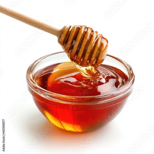 Honey pot and dipper on white background.