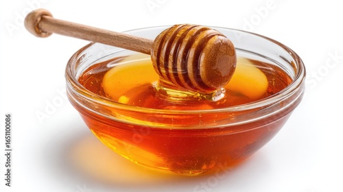Honey pot and dipper on white background.