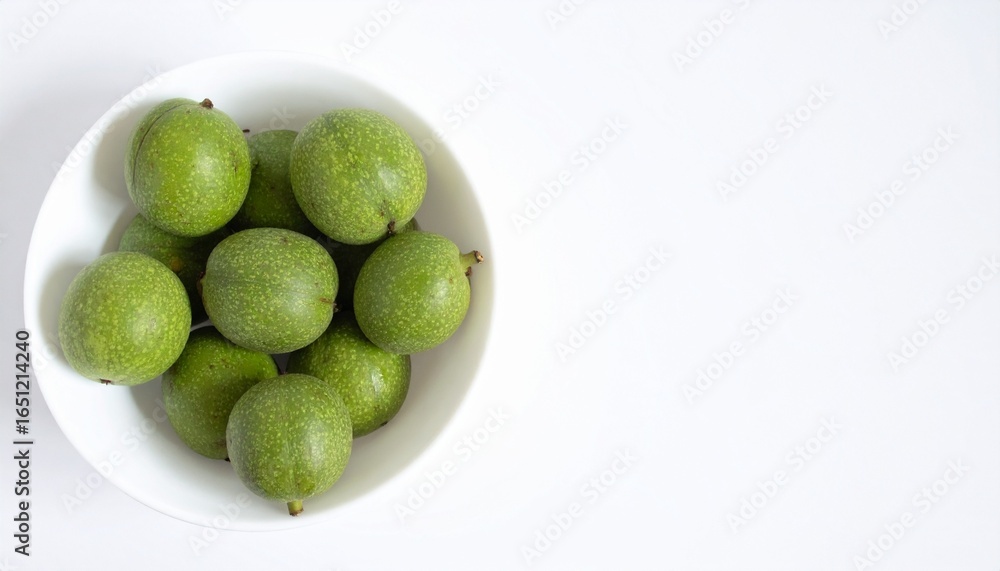 Fototapeta premium Green walnuts isolated on white background
