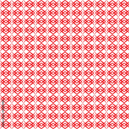 Intricate red and white geometric pattern with diamond motifs