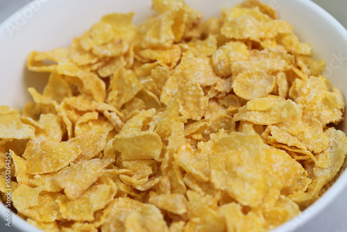 Fotografie Yellow frosted corn flakes bowl for dry, cereals breakfast
