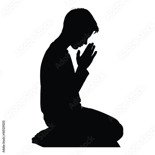 Silhouette of a Young Man Praying on His Knees Offering Hope and Supplication for Spiritual Guidance and Inner Peace