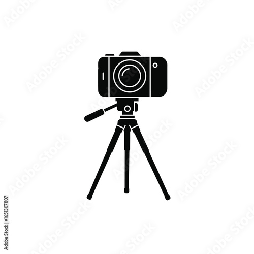 Black camera on tripod white photography