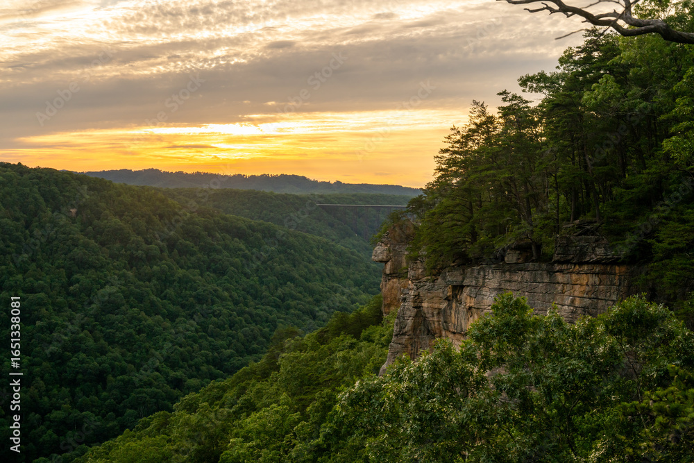Obraz premium Sunset Over The Endless Wall And The Bridge In The Distance Of New River Gorge