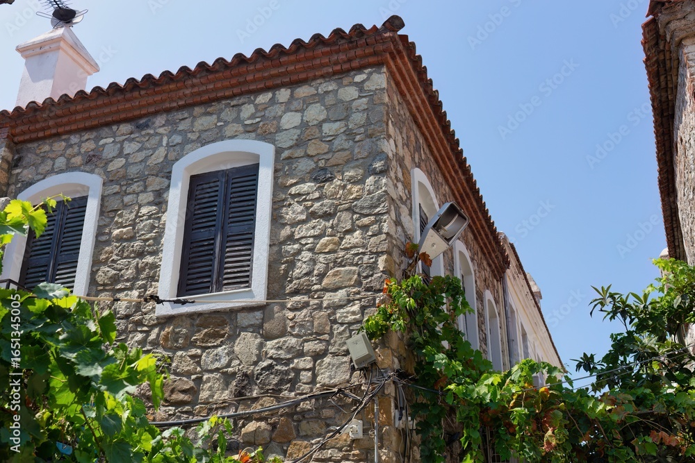 A stone building with a red tile roof is shown in old Marmaris - Mugla - Turkey A stone building with a red tile roof is shown in old Marmaris - Mugla - Turkey
