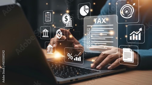 Glowing tax data surrounds hands typing on a laptop Financial planning is made simple with transparent graphs and intuitive user interfaces