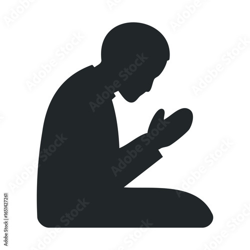 Silhouette of person in kneeling prayer position on white background