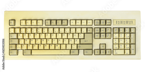 Vintage computer keyboard from the 1990s isolated on white background.