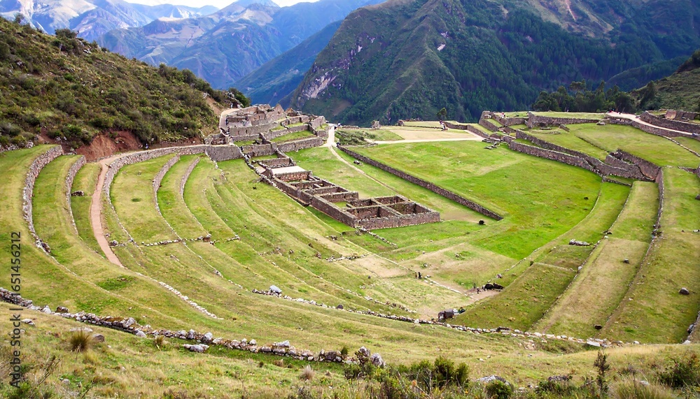 Fototapeta premium Ancient terraced fields and ruins on a mountain slope.