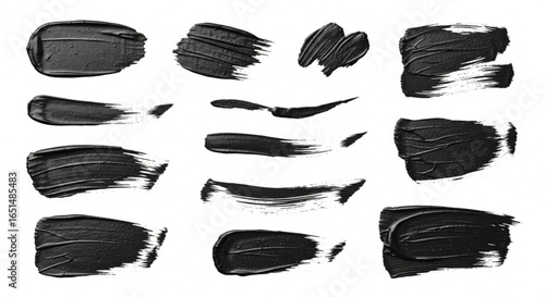 Black paint strokes, various shapes on a white background, artistic expression