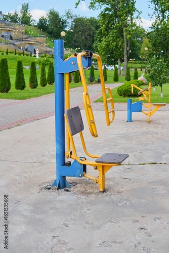 Wallpaper Mural Outdoor metal yellow and blue exercise machines for sports in the park. Outdoor sports, workout. Torontodigital.ca