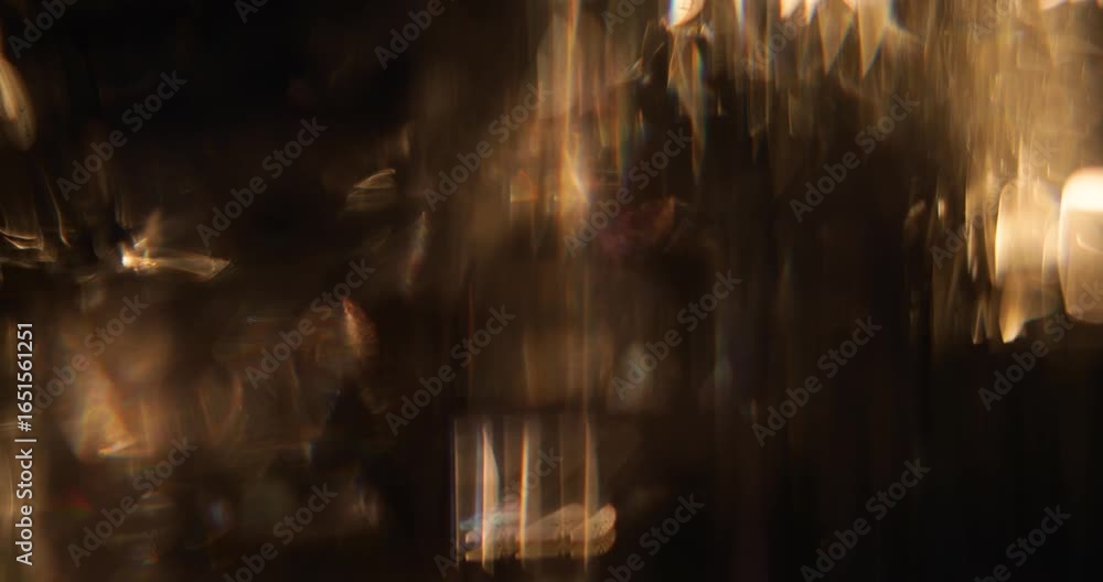 Abstract blurred light leaks on dark background with copy space. Studio anamorphic lens flare bokeh effect for title or logo display.