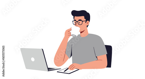 Young Man Drinking Coffee While Working on Laptop, Smiling