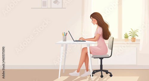 Stylish young woman with long brown hair in a pink dress working on a laptop at a white desk.