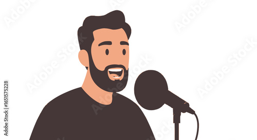 A young bearded man with dark hair speaking enthusiastically into a studio microphone.