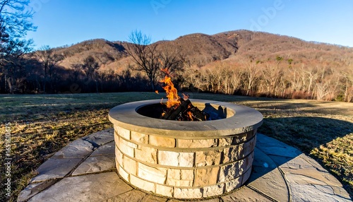 Outdoor fire pit with a scenic mountain view.