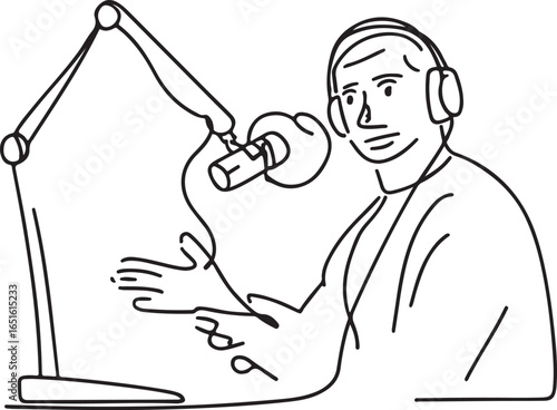Man wearing headphones speaking into a microphone on a boom arm with a computer screen podcasting radio
