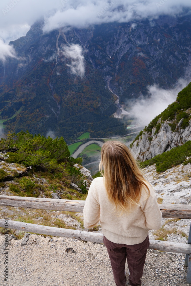 Naklejka premium Woman Overlooking the Mountains in the Fall