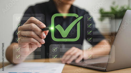 Person using a stylus to check off items on a digital checklist with a large green checkmark