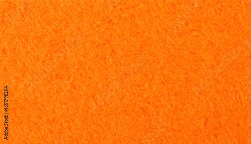 Close-up textured shot of a bright orange fuzzy fabric