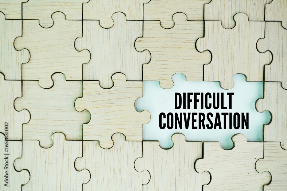 Fototapeta premium Wooden puzzle with stick with the word DIFFICULT CONVERSATION. difficult concept of conversation