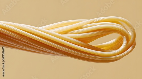 Curled Twisted Uncooked Yellow Pasta Noodles on Solid Background in Kitchen Environment