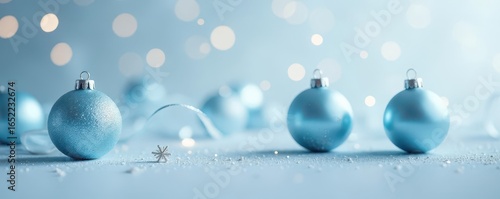 Delicate light blue Christmas spheres & silver White background with soft bokeh , pastel, festive, background