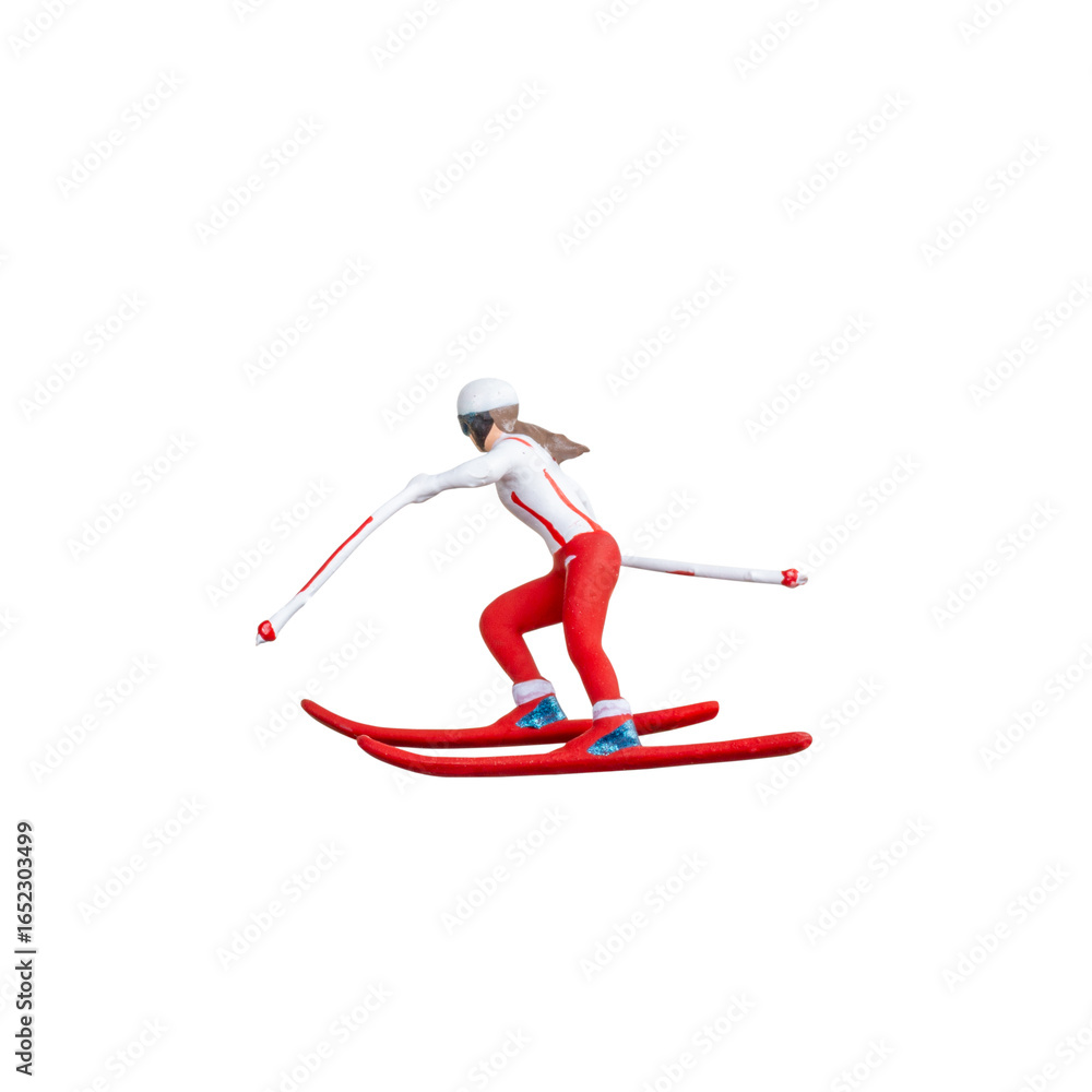 Obraz premium Miniature skier figure standing alone on white background with clean clipping path