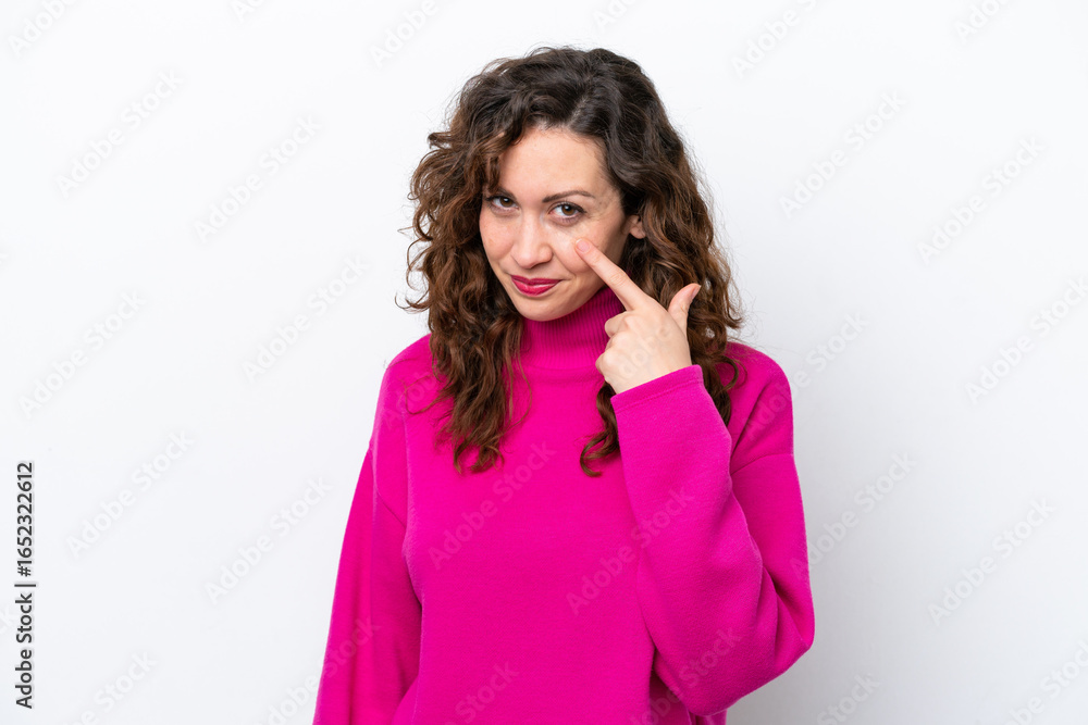 Fototapeta premium Young caucasian woman isolated on white background showing something