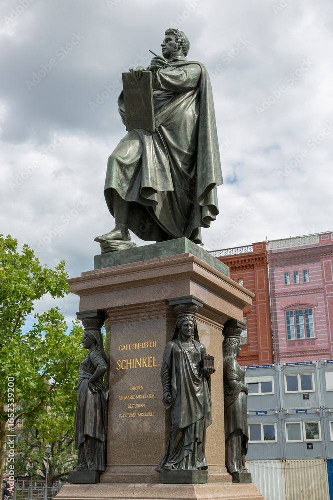 Obraz premium Berlin, Germany - July 01, 2018: The bronze statue of Karl Friedrich Schinkel in the center of Berlin.
