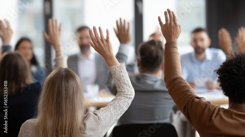 Diverse Group Raising Hands in Meeting: Active Participation and Engagement in Business Setting