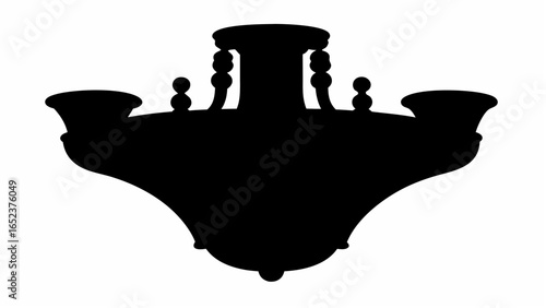 Silhouette of an ornate chandelier featuring multiple tiers and decorative elements in a solid dark shade