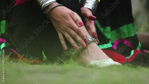 Closeup shot of women leg wearing anklet.