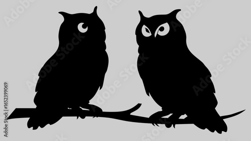 Owl Silhouette in Twilight: Two majestic owl silhouettes perched on a branch against a soft backdrop, embodying wisdom, mystery and nocturnal charm in the quiet of dusk.