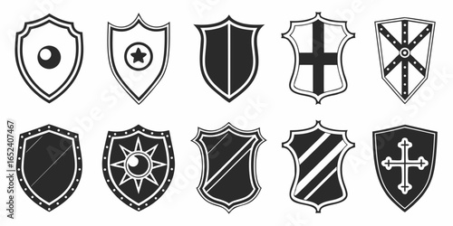 Collection of diverse shield icons in black and white representing security protection heraldry and medieval warfare symbols