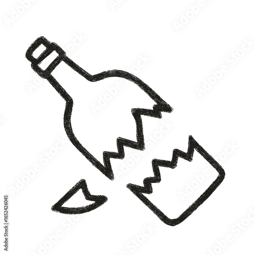 Broken bottle fragment lying on the ground with jagged edges  