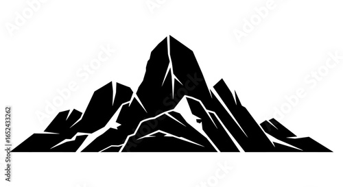 Black mountain range with sharp peaks and jagged snow patches