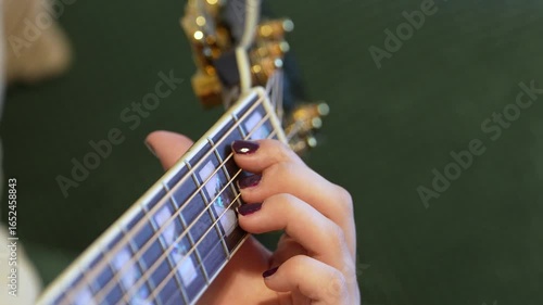 girl playing acoustic guitar