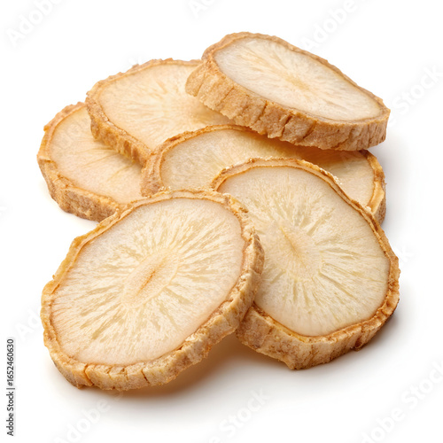 Dried ginseng root slices arranged on a white background, highlighting their light beige color